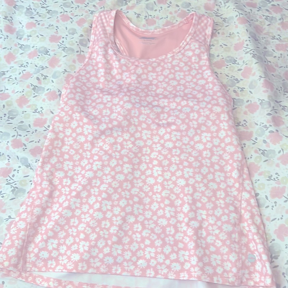 I am selling a pink tank top size (14/16) kids best used for athletic wear